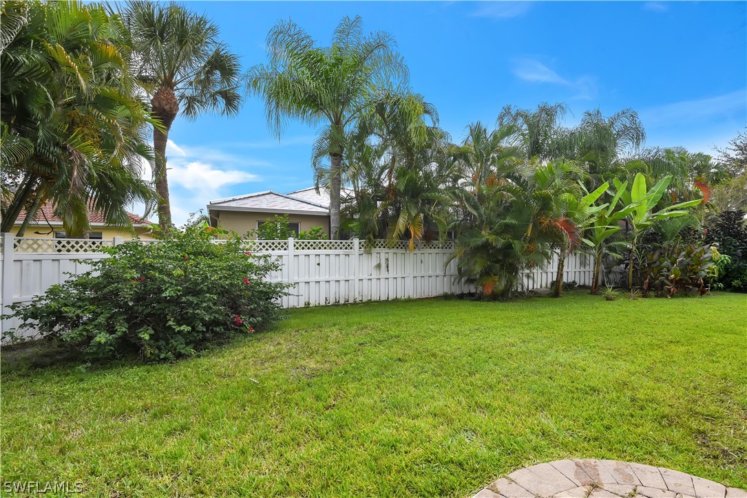 12831 Timber Ridge Drive Fort Myers, FL 33913 - Photo 16 of 16 a view of a backyard with a garden