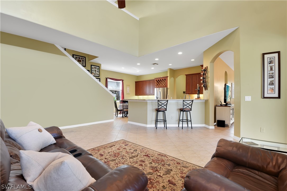 12831 Timber Ridge Drive Fort Myers, FL 33913 - Photo 3 of 16 a living room with furniture and kitchen view
