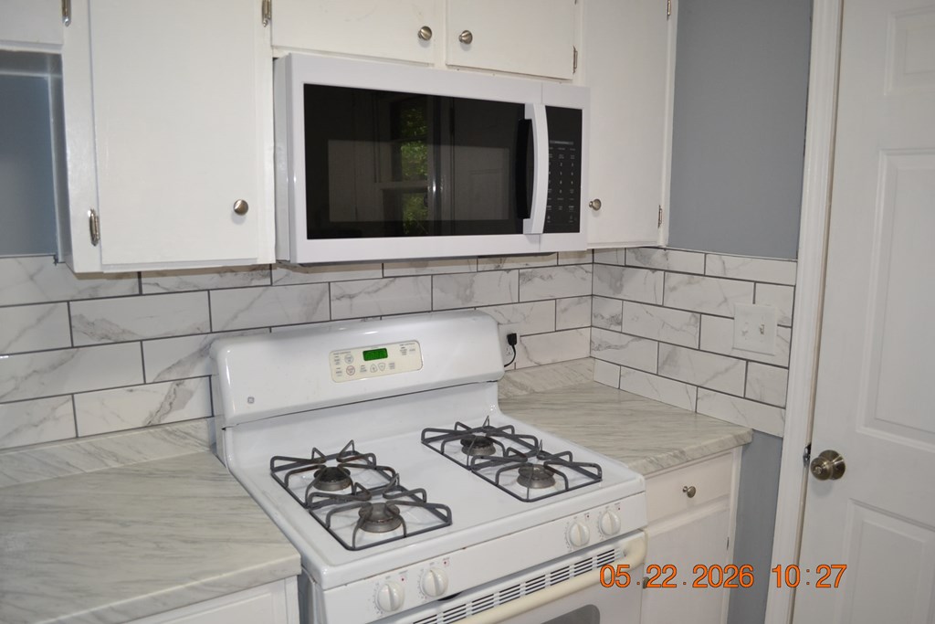 5552 Valleybrook Road Columbus, GA 31907 - Photo 8 of 27 a kitchen with a stove and a microwave
