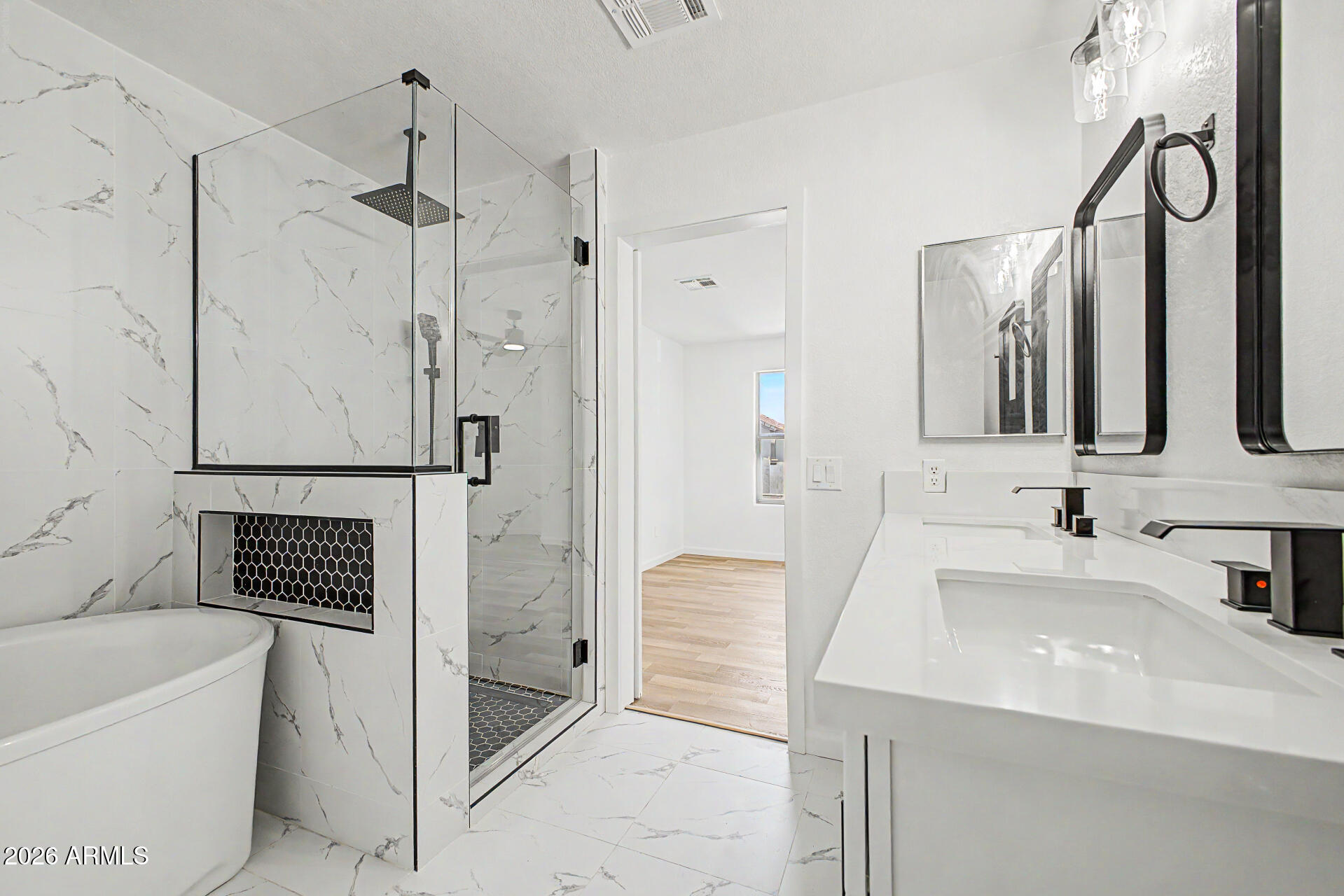 6452 West Ruth Avenue Glendale, AZ 85302 - Photo 24 of 35 a bathroom with a bathtub and a sink