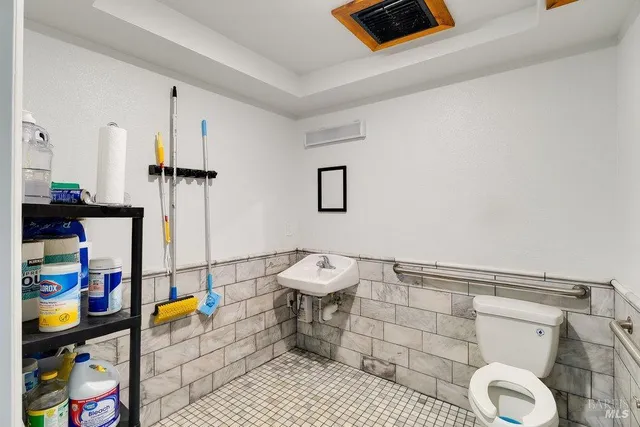 a bathroom with a toilet and a sink