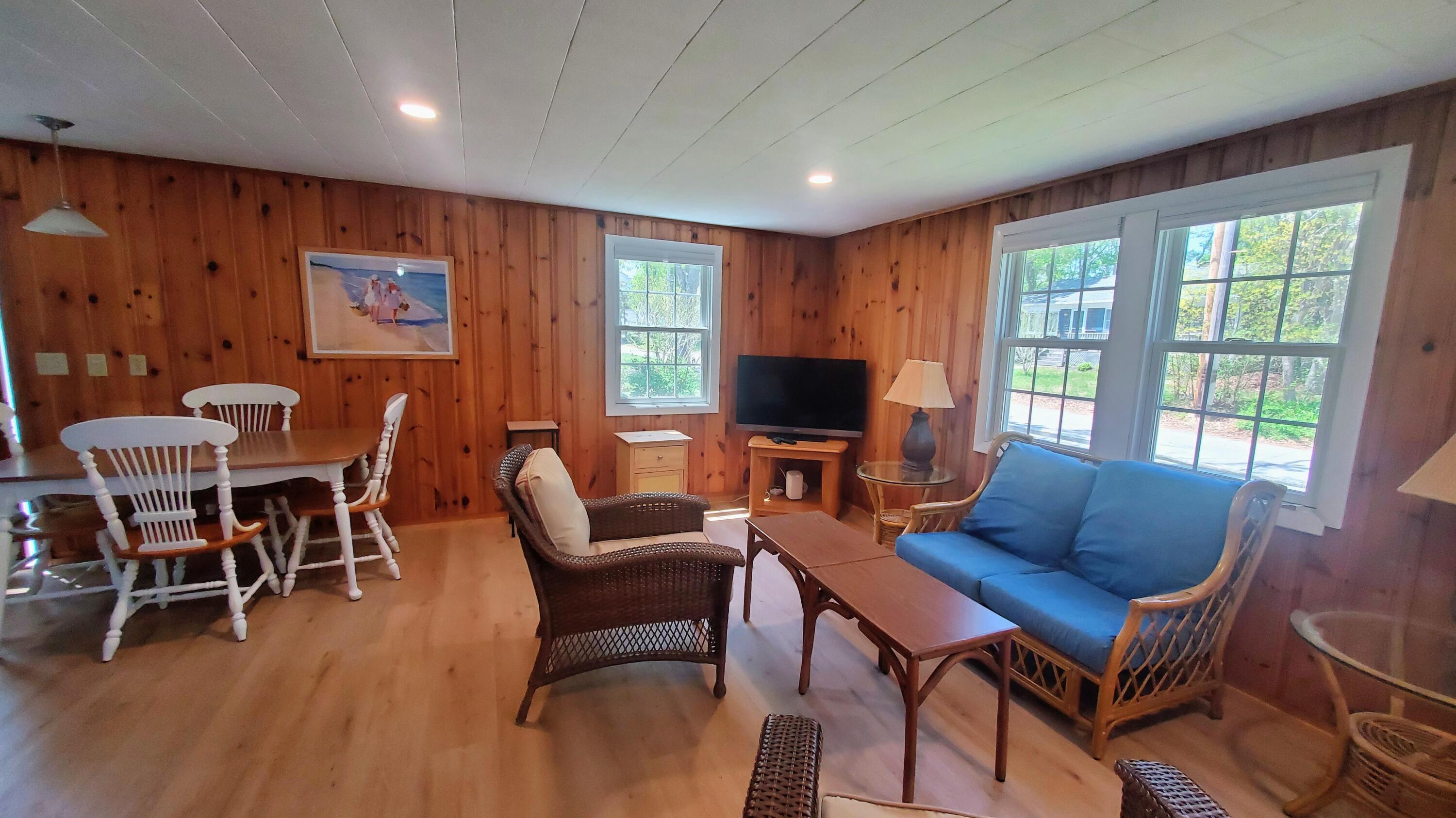 66 Uncle Edwards Road Mashpee, MA 02649 - Photo 4 of 18 a view of a livingroom with furniture and a flat screen tv