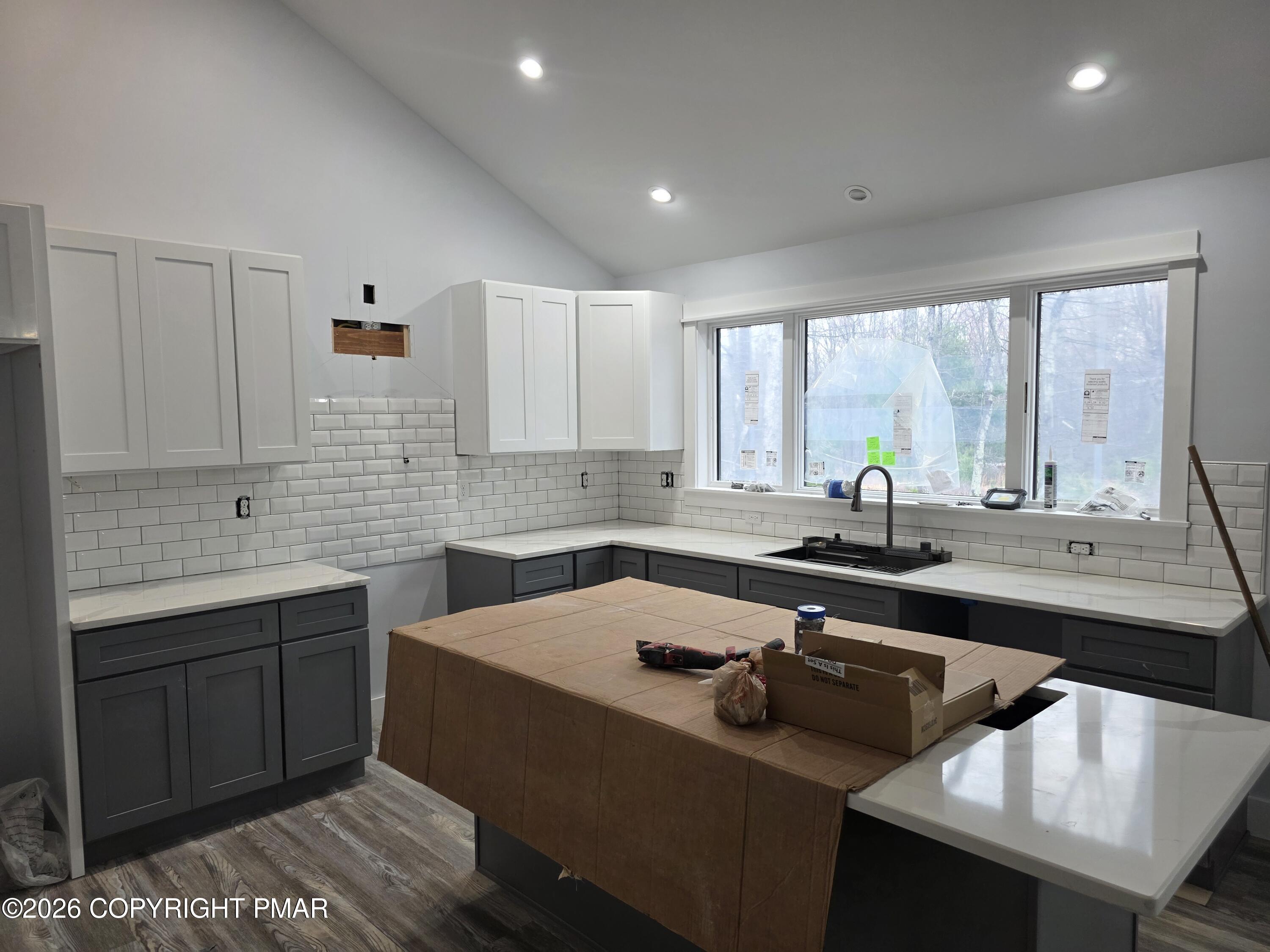 399 Stony Mountain Road Jim Thorpe, PA 18229 - Photo 2 of 4 a kitchen with a sink stove and cabinets