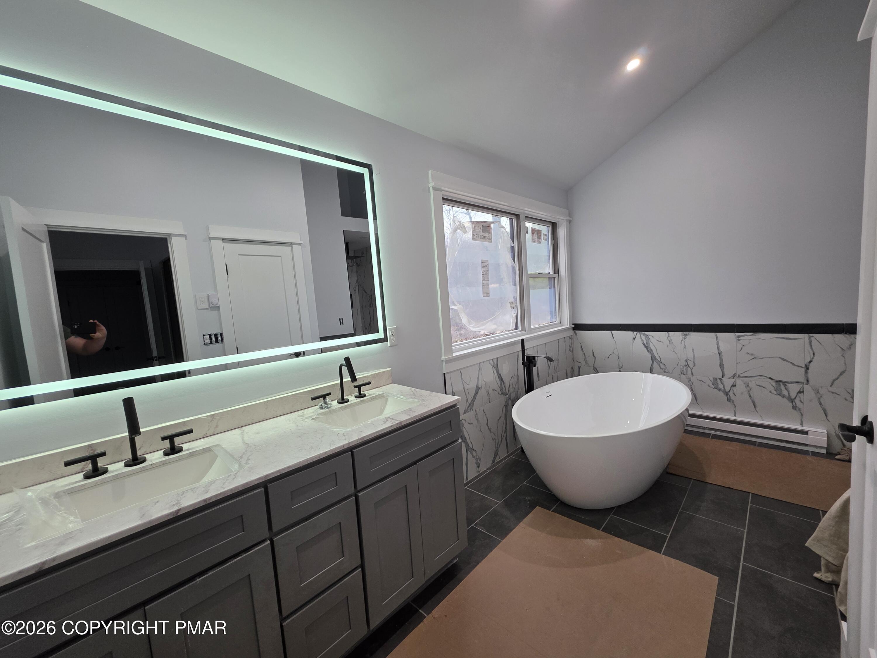 399 Stony Mountain Road Jim Thorpe, PA 18229 - Photo 4 of 4 a spacious bathroom with a double vanity sink mirror and toilet