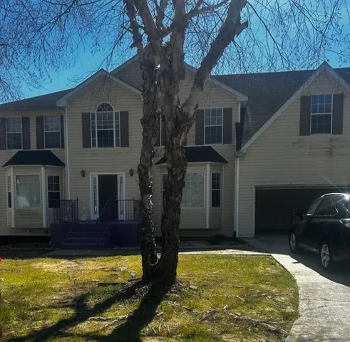 a view of a house with swimming pool