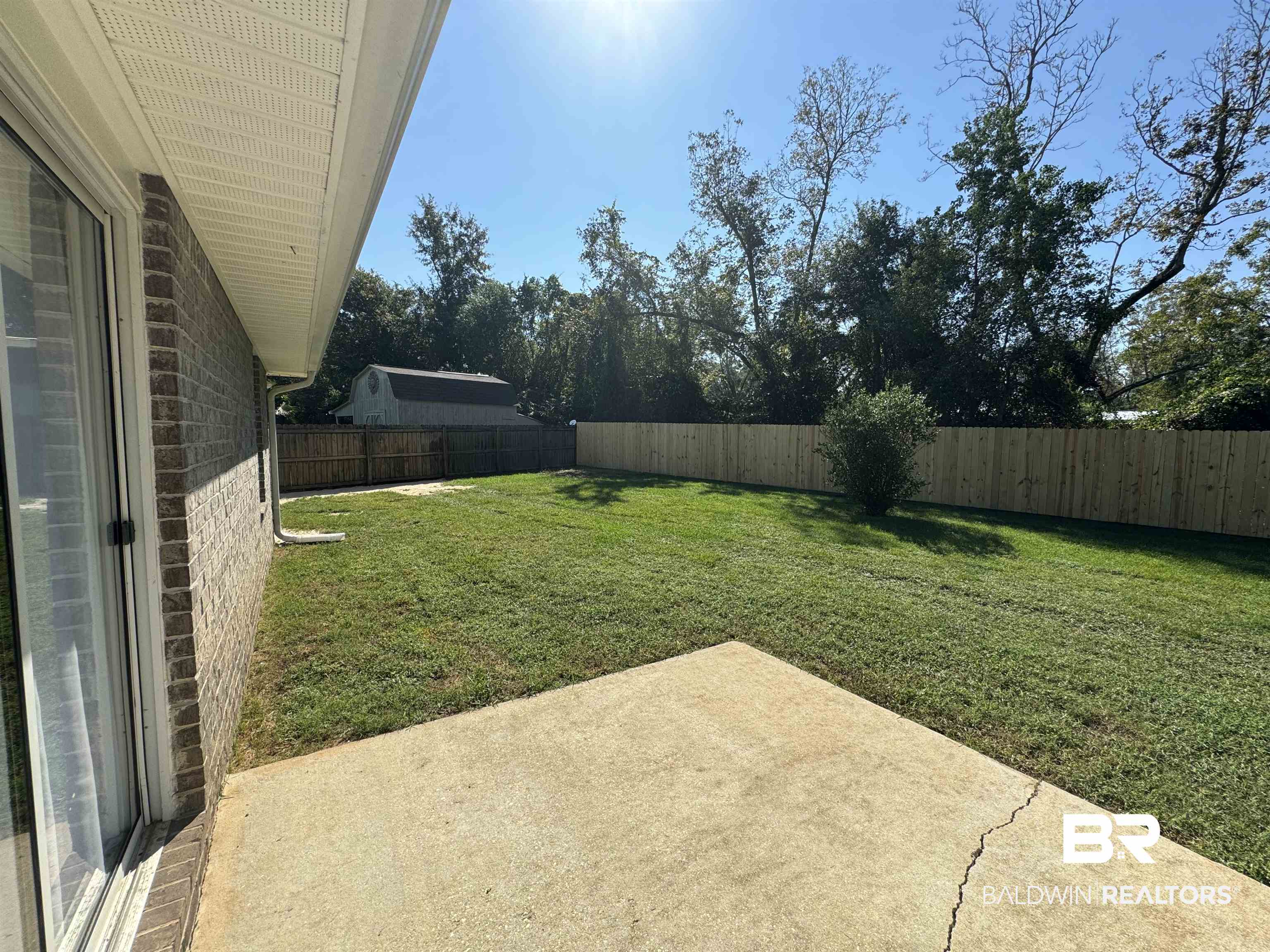 32769 Arbor Ridge Circle Lillian, AL 36549 - Photo 30 of 36 View of yard featuring a patio
