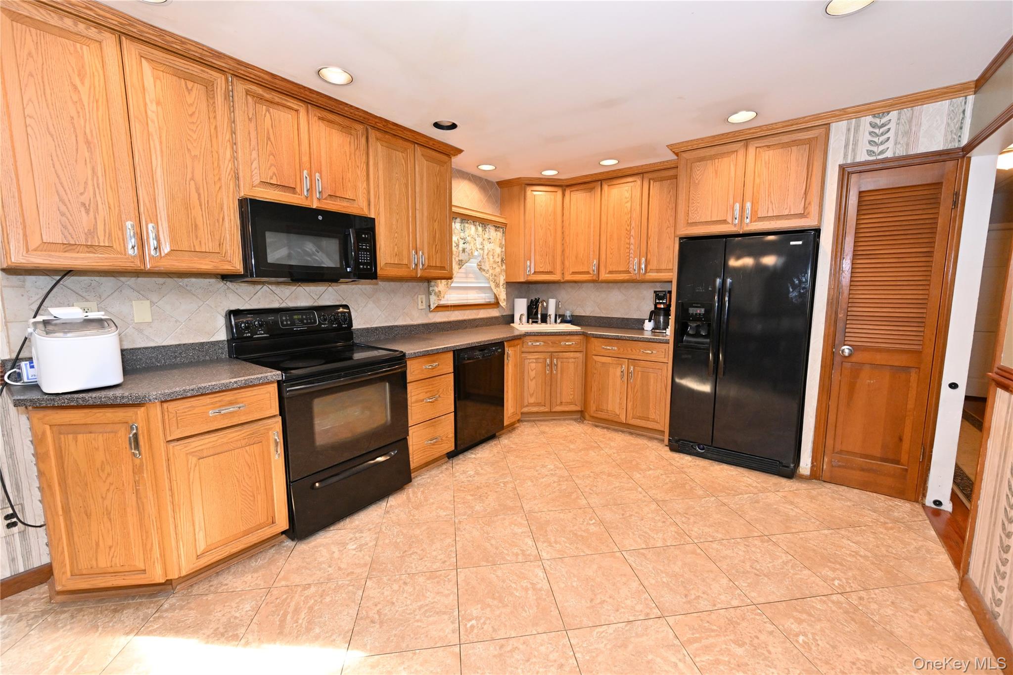 41 Harkin Road Carmel, NY 10512 - Photo 5 of 20 a kitchen with stainless steel appliances granite countertop a refrigerator stove top oven a sink and dishwasher