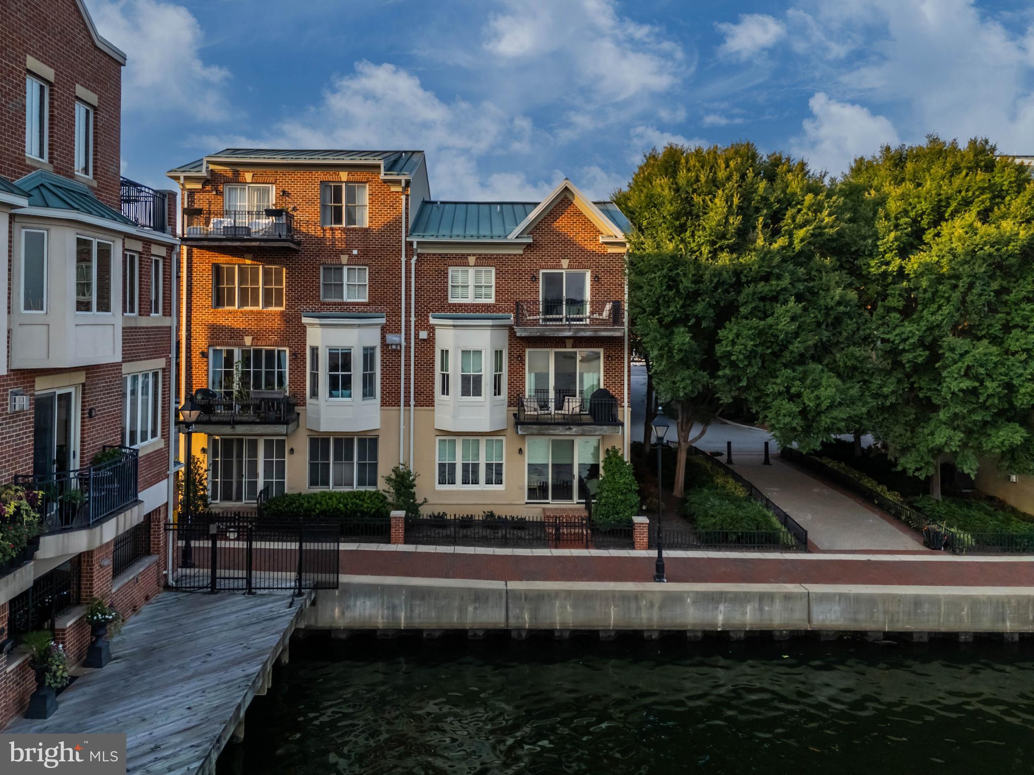2325 Boston Street, Unit 2 Baltimore, MD 21224 - Photo 2 of 48 a front view of a house with a yard