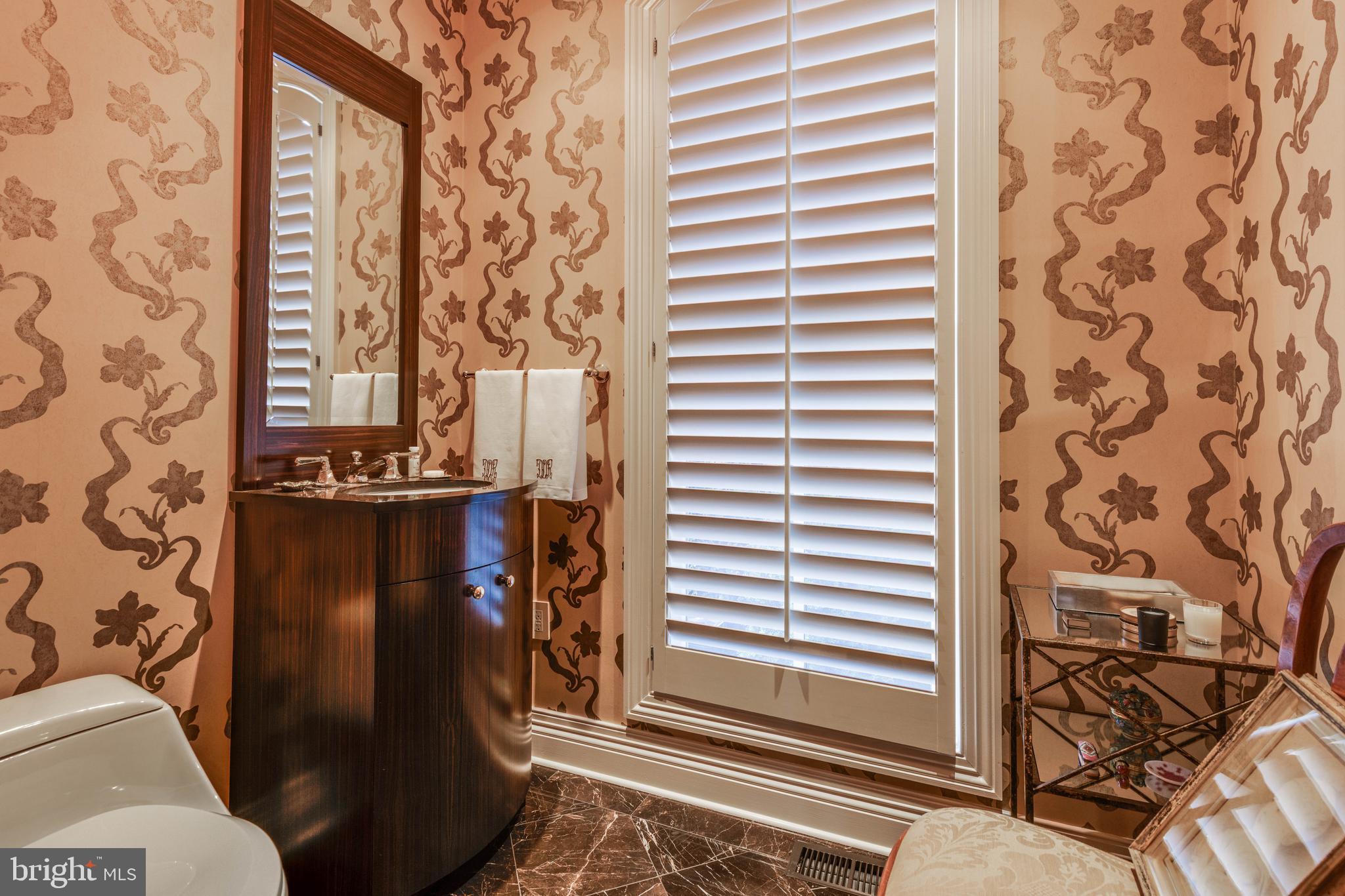 2325 Boston Street, Unit 2 Baltimore, MD 21224 - Photo 27 of 48 a bathroom with a toilet and a shower curtain