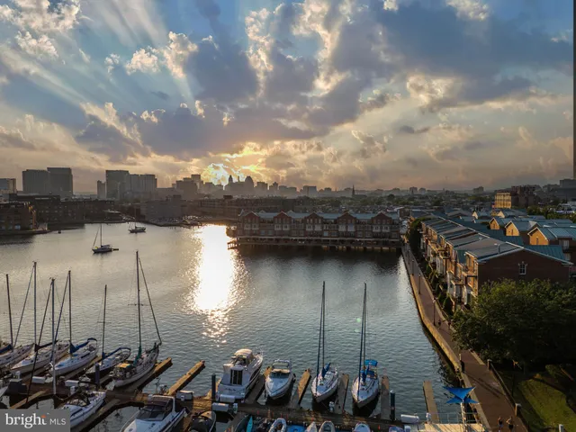 a bathroom with a shower mirror and a sink