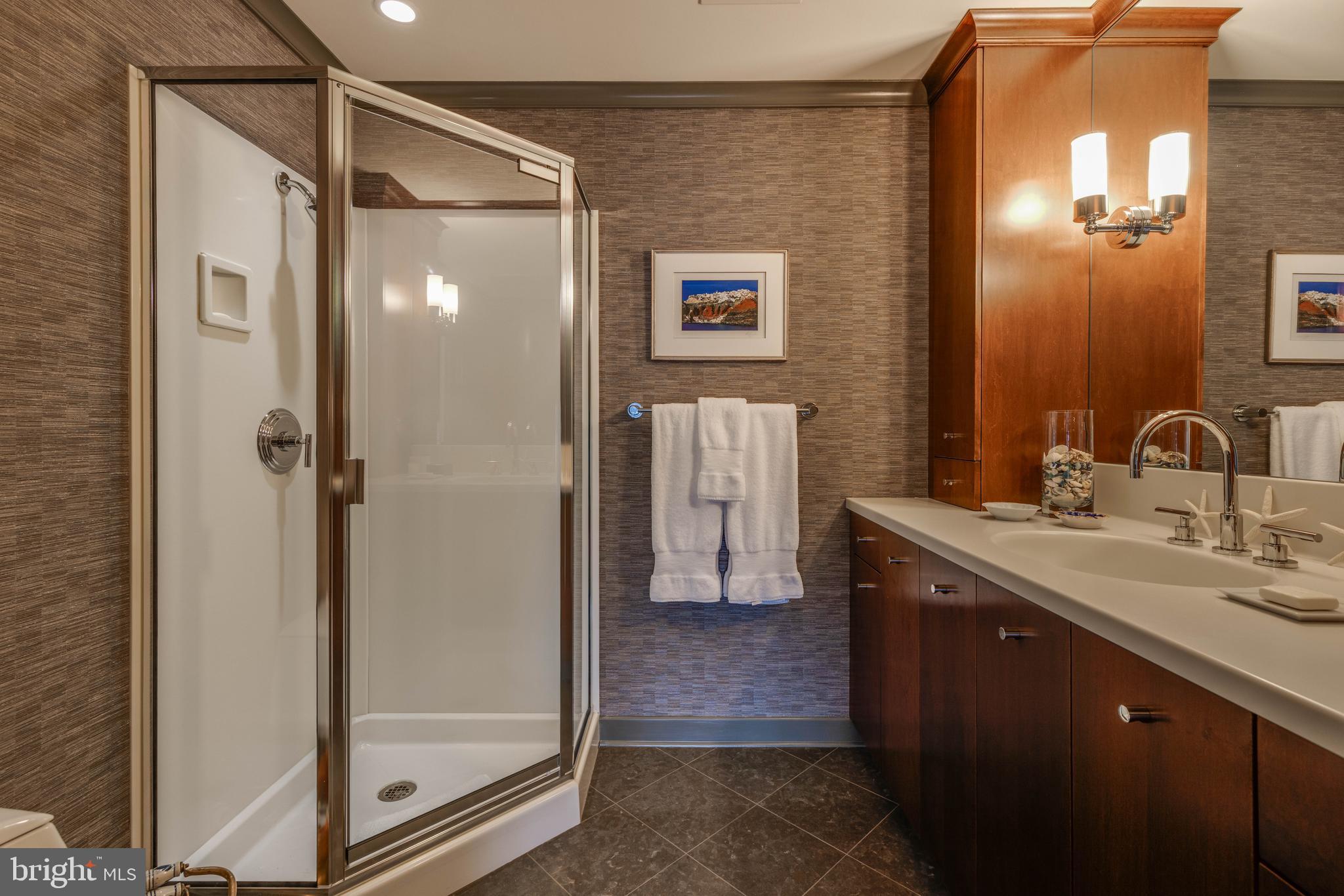 2325 Boston Street, Unit 2 Baltimore, MD 21224 - Photo 32 of 48 a bathroom with a shower mirror and a sink