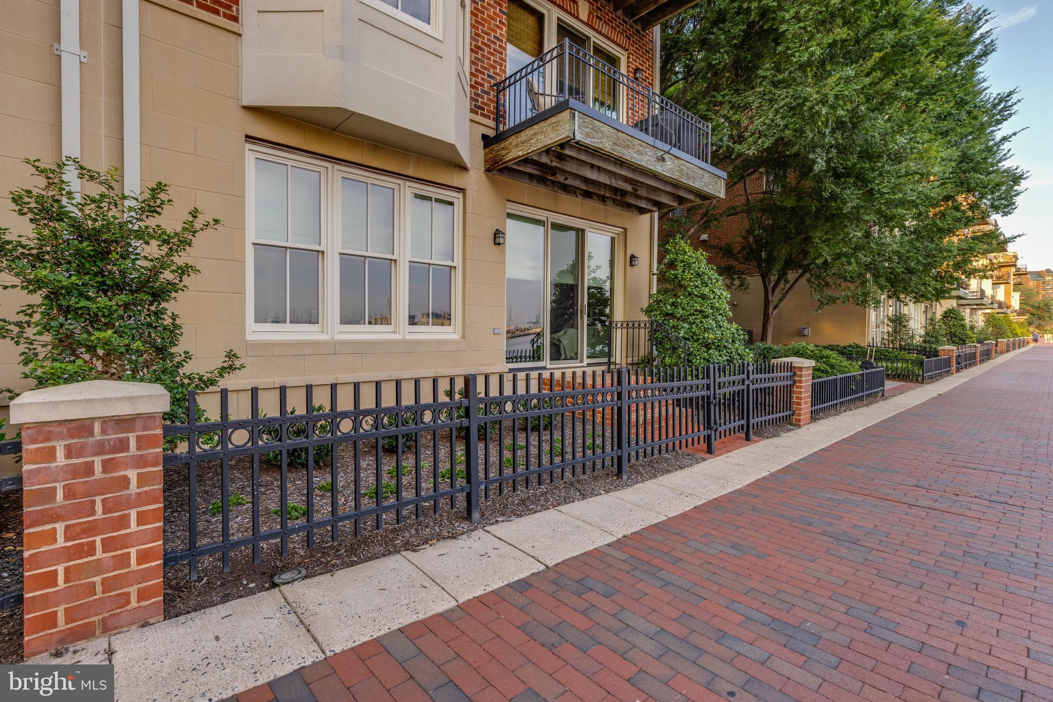 2325 Boston Street, Unit 2 Baltimore, MD 21224 - Photo 33 of 48 a balcony with wooden floor and fence