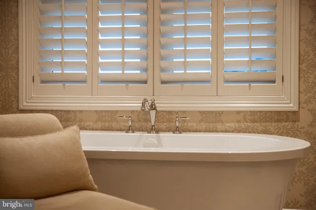 a view of a storage and utility room with washer dryer