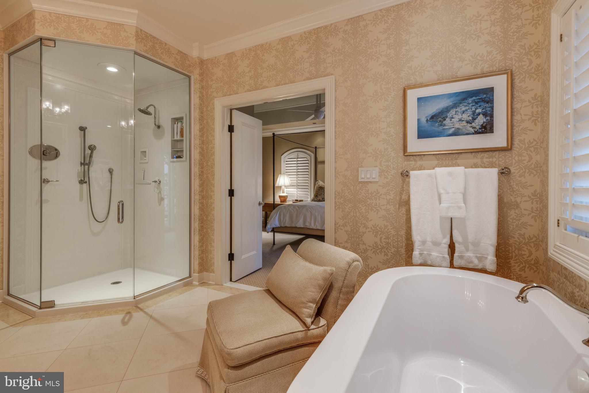 2325 Boston Street, Unit 2 Baltimore, MD 21224 - Photo 39 of 48 a en suite spacious bathroom with a tub shower and mirror