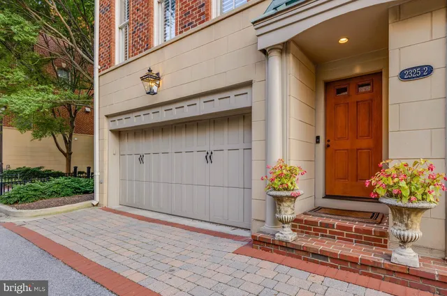 a view of a pathway with a wrought fence