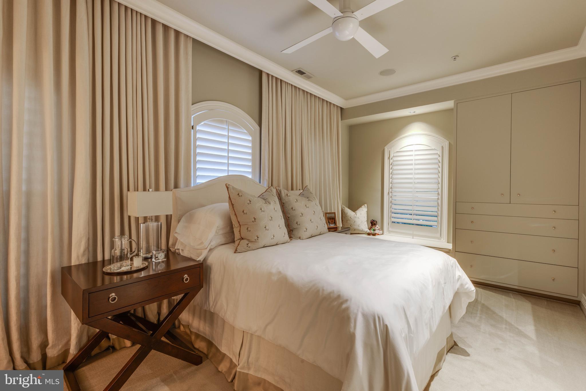 2325 Boston Street, Unit 2 Baltimore, MD 21224 - Photo 42 of 48 a bedroom with a bed and a table