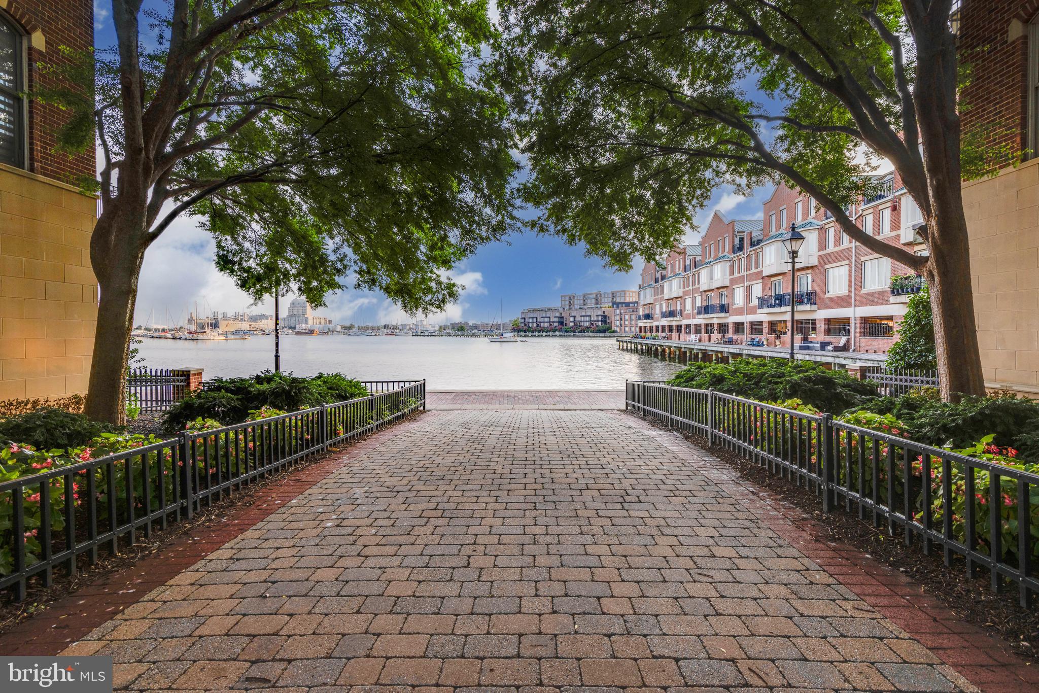 2325 Boston Street, Unit 2 Baltimore, MD 21224 - Photo 5 of 48 a view of a pathway with a wrought fence