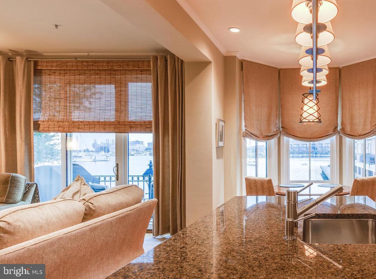 2325 Boston Street, Unit 2 Baltimore, MD 21224 - Photo 7 of 48 a living room with furniture fireplace and a large window