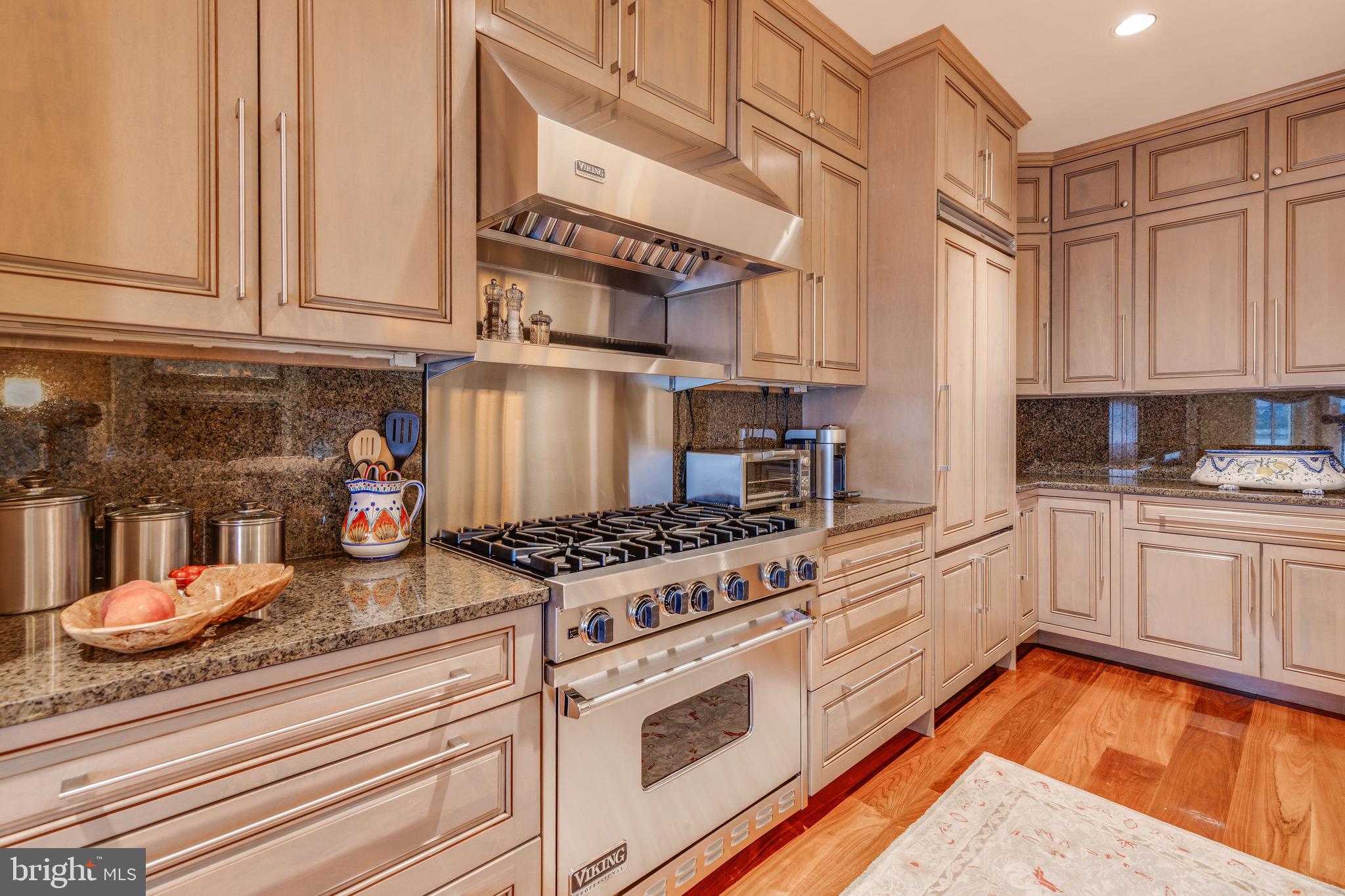 2325 Boston Street, Unit 2 Baltimore, MD 21224 - Photo 9 of 48 a kitchen with stainless steel appliances granite countertop a stove a sink and white cabinets