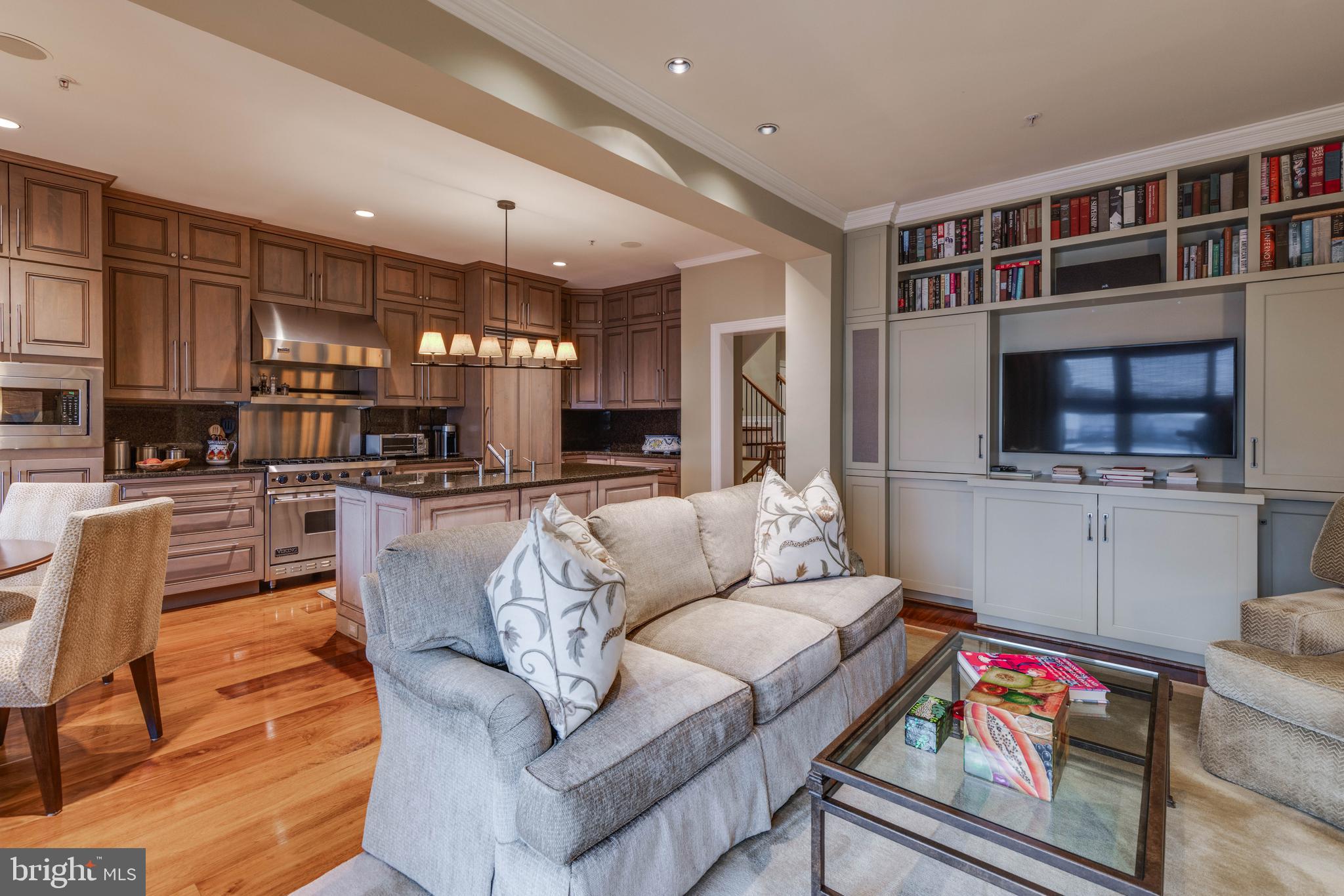 2325 Boston Street, Unit 2 Baltimore, MD 21224 - Photo 10 of 48 a living room with fireplace furniture and a flat screen tv