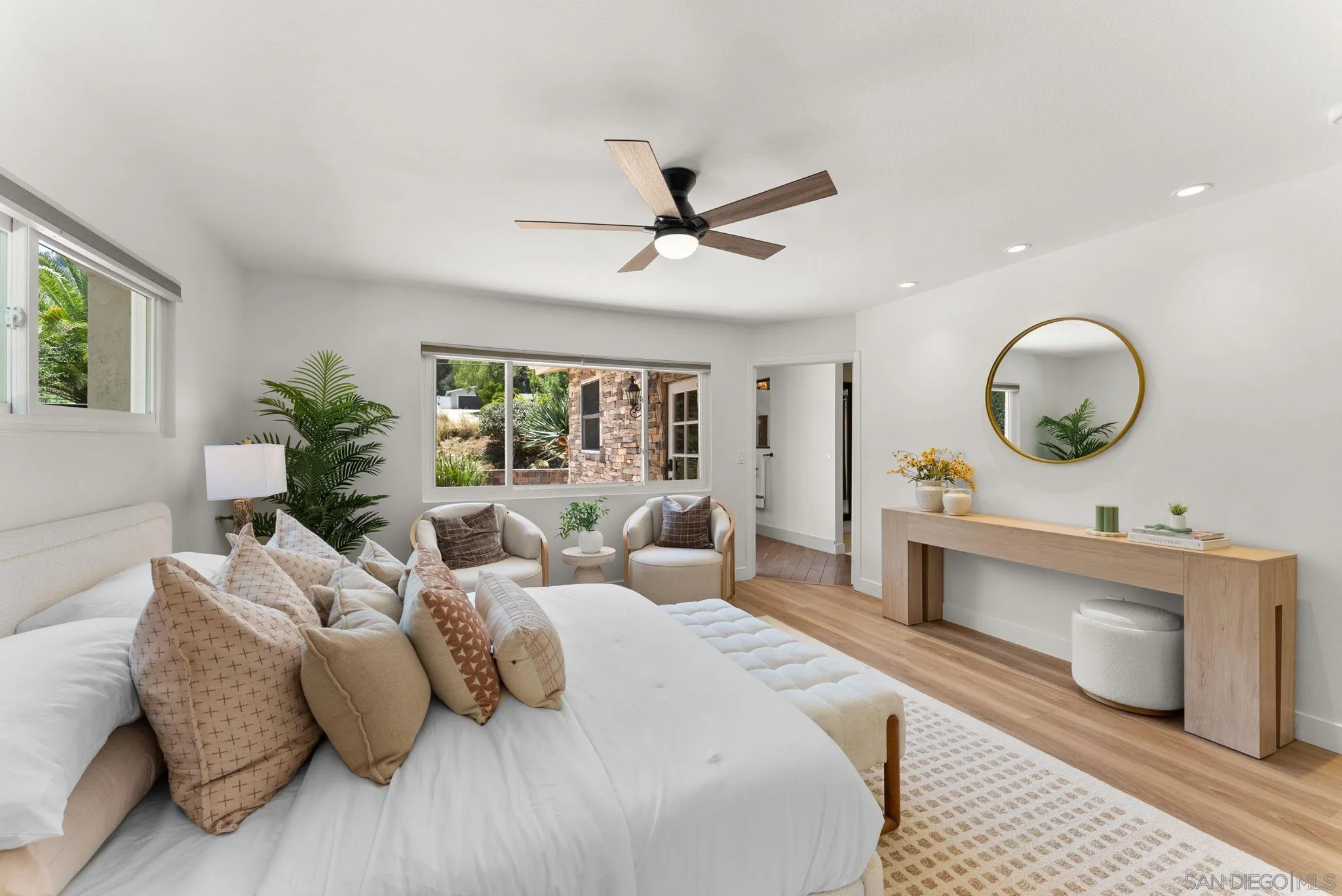 12832 Stone Canyon Road Poway, CA 92064 - Photo 19 of 60 a bedroom with a large bed and a chandelier