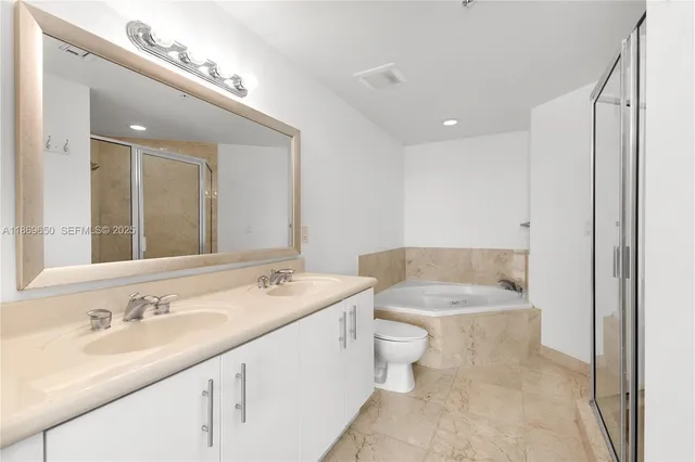 a kitchen with a stove and a refrigerator