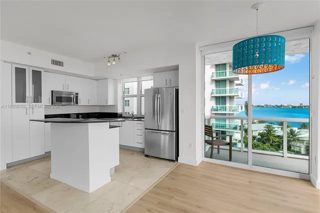 a bathroom with a toilet a sink a mirror a bathtub and a shower