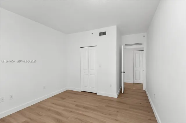 a view of roof deck with a barbeque and wooden stairs