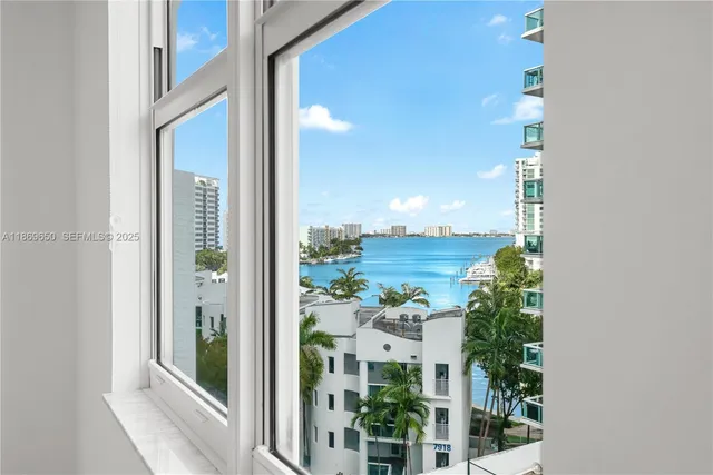 a view of a lake with boats and trees