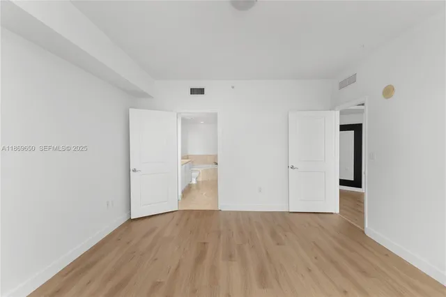 a view of a storage & utility room with wooden floor