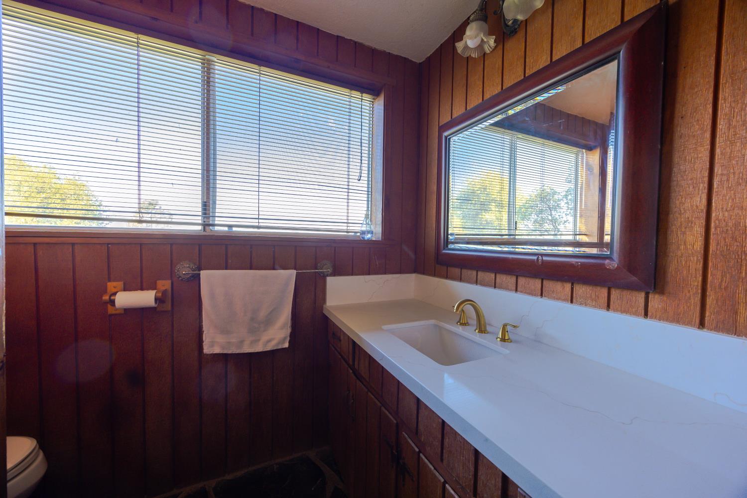 34107 Memory Lane Coarsegold, CA 93614 - Photo 15 of 46 a bathroom with a sink and a bathtub