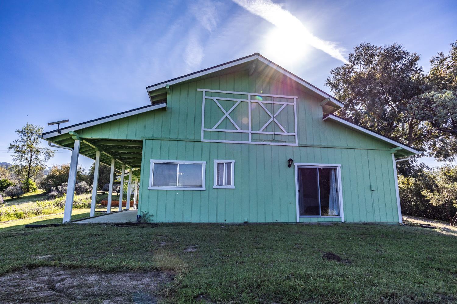 34107 Memory Lane Coarsegold, CA 93614 - Photo 23 of 46 a front view of a house with garden