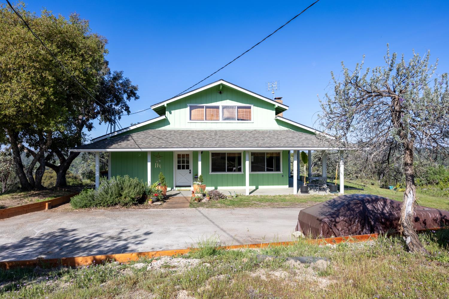 34107 Memory Lane Coarsegold, CA 93614 - Photo 24 of 46 a front view of a house with a yard