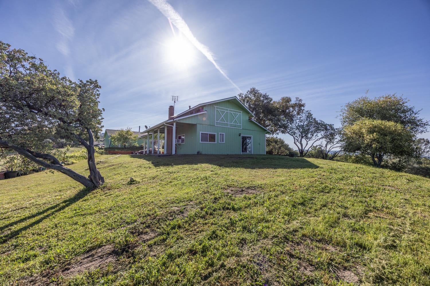 34107 Memory Lane Coarsegold, CA 93614 - Photo 33 of 46 a house view with a garden space