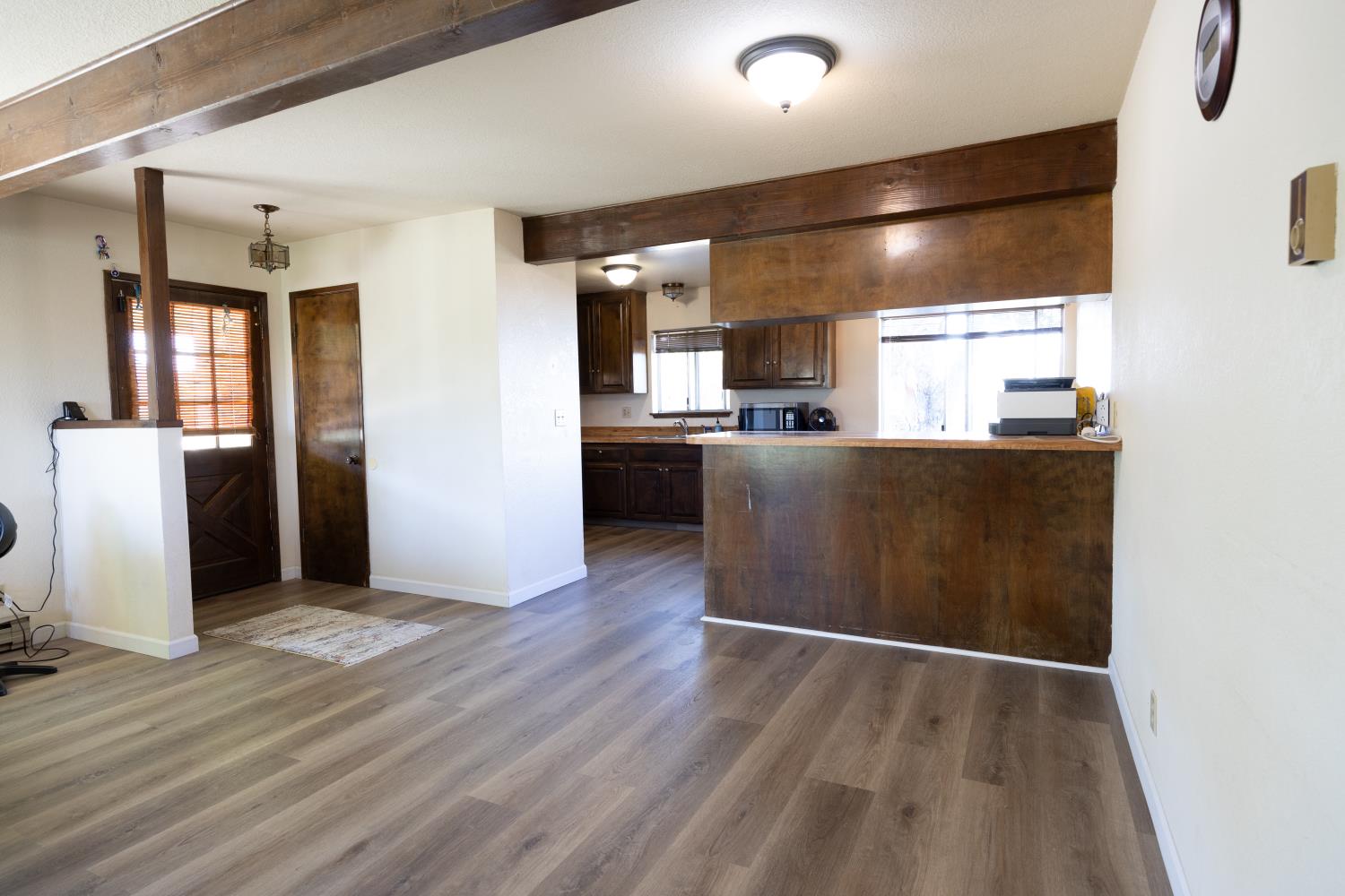 34107 Memory Lane Coarsegold, CA 93614 - Photo 7 of 46 a kitchen with stainless steel appliances a refrigerator and wooden floor