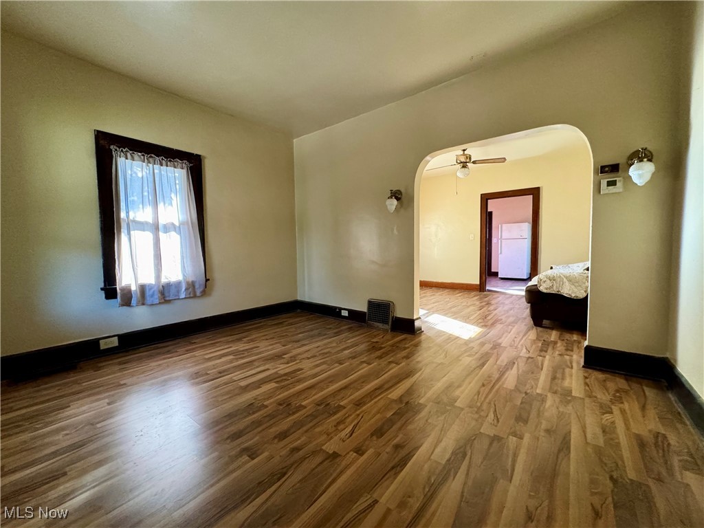 1325 Walnut Road Southeast Massillon, OH 44646 - Photo 26 of 34 Empty room with wood-type flooring and ceiling fan