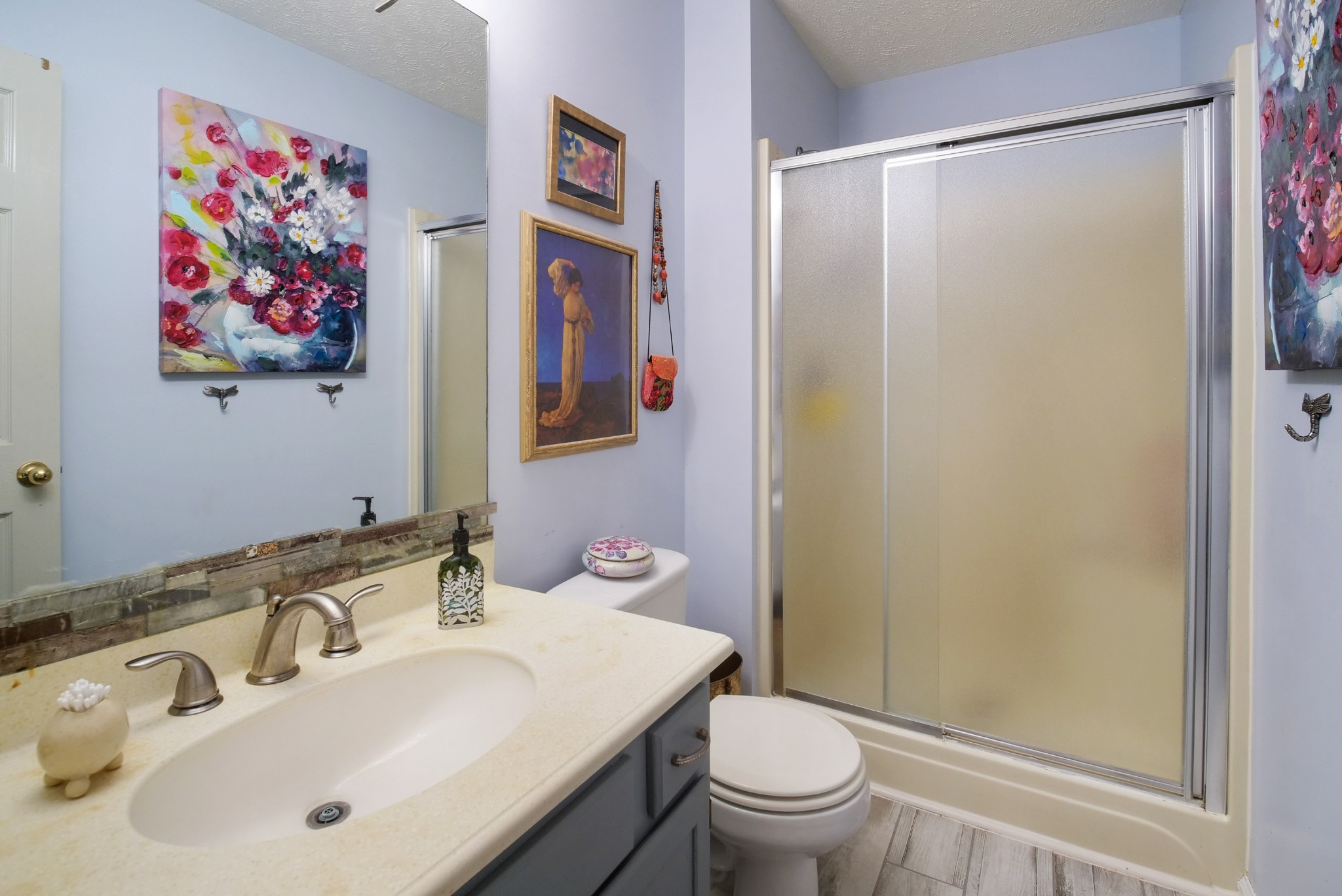 137 Gaskins Road Dickson, TN 37055 - Photo 19 of 38 a bathroom with a sink and a mirror