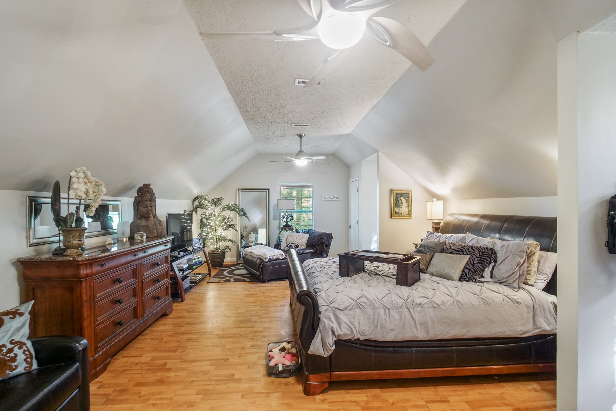 137 Gaskins Road Dickson, TN 37055 - Photo 23 of 38 a bedroom with a large bed and wooden floors