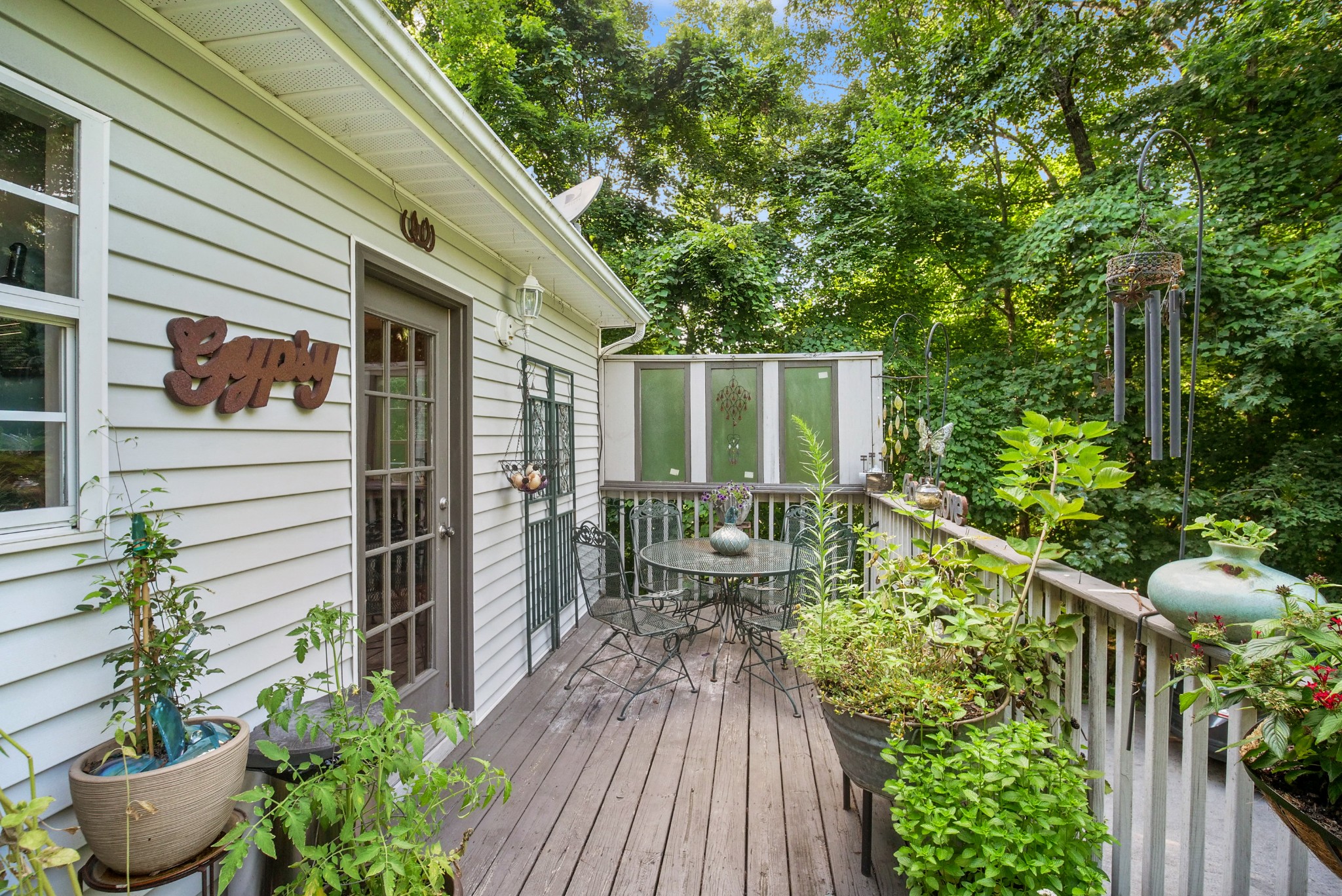 137 Gaskins Road Dickson, TN 37055 - Photo 34 of 38 a balcony with wooden floor potted plants and outdoor seating