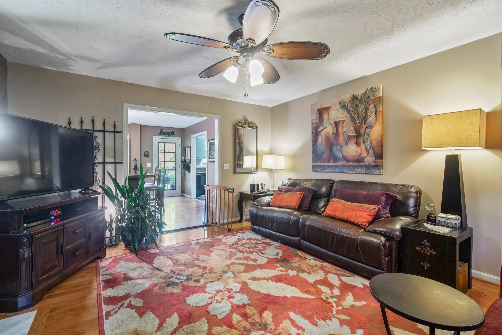 137 Gaskins Road Dickson, TN 37055 - Photo 9 of 38 a living room with furniture and a flat screen tv