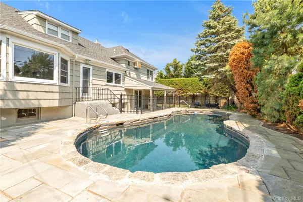 a view of a house with swimming pool