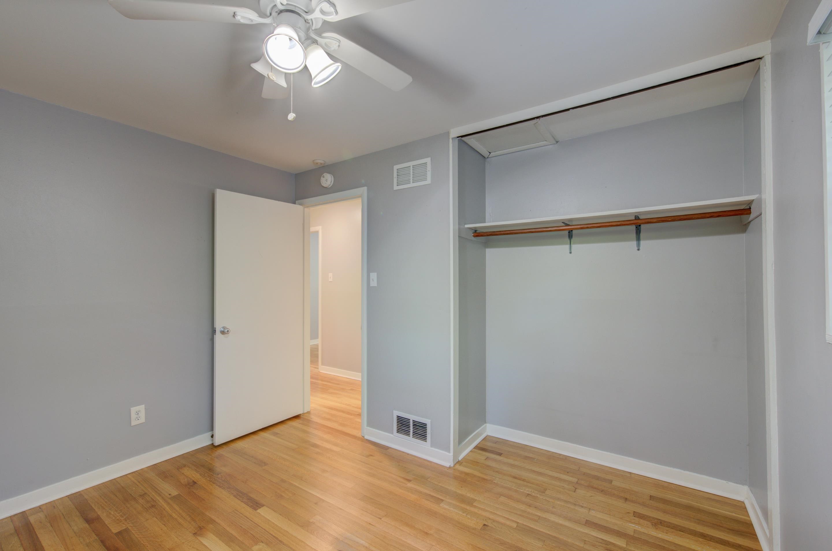 1059 Wellsville Road Memphis, TN 38117 - Photo 15 of 20 a view of an empty room with wooden floor and a window