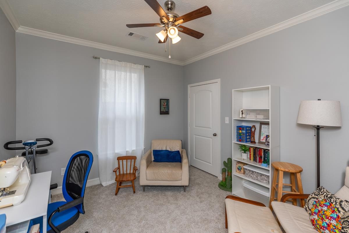314 Long Leaf Street Silsbee, TX 77656 - Photo 23 of 31 a bedroom with furniture and a window