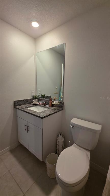 36352 Wl Hl Way Zephyrhills, FL 33541 - Photo 14 of 32 a bathroom with a toilet a sink and mirror