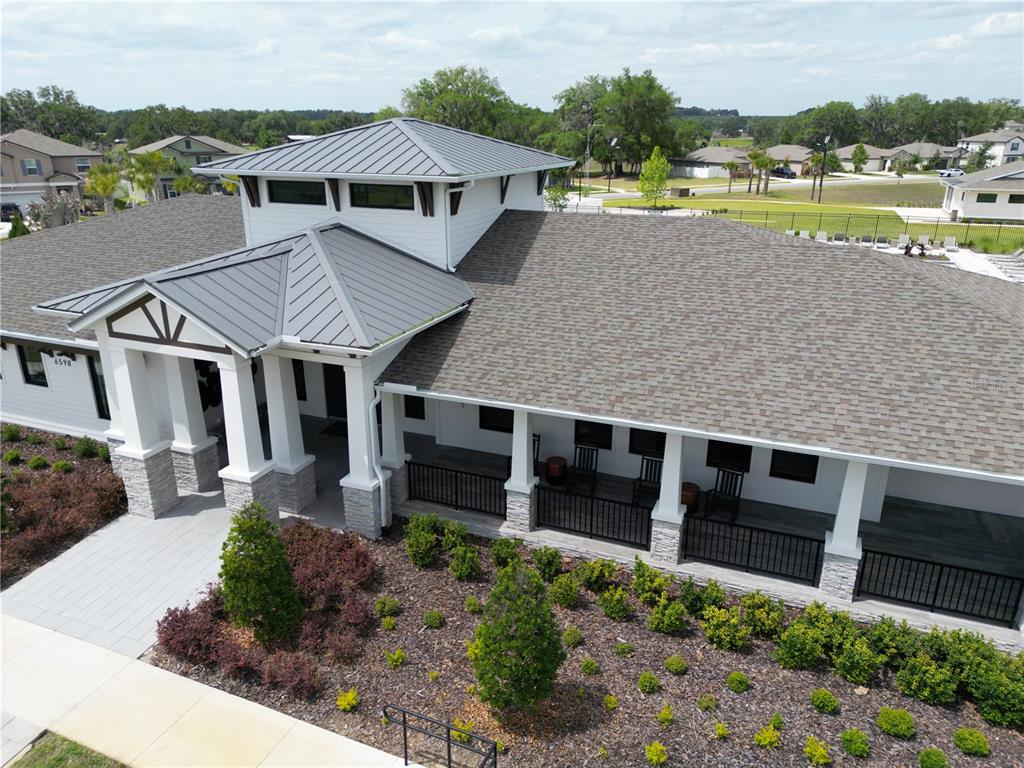 36352 Wl Hl Way Zephyrhills, FL 33541 - Photo 29 of 32 an aerial view of a house with a garden and lake view