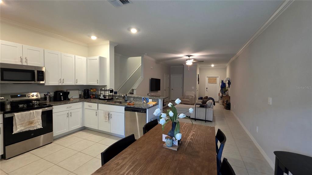 36352 Wl Hl Way Zephyrhills, FL 33541 - Photo 3 of 32 a kitchen with a sink microwave and cabinets