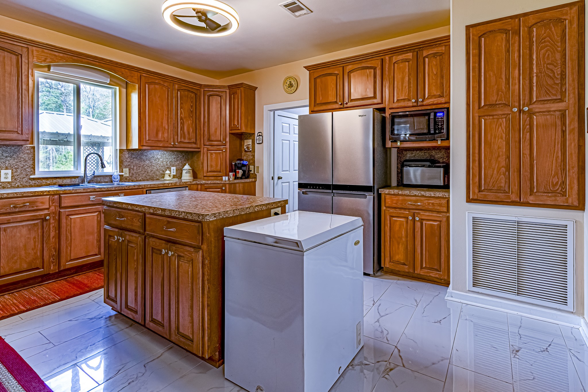 188 Pullin Road Corrigan, TX 75939 - Photo 8 of 50 a kitchen with stainless steel appliances granite countertop a refrigerator a sink dishwasher a stove and a refrigerator