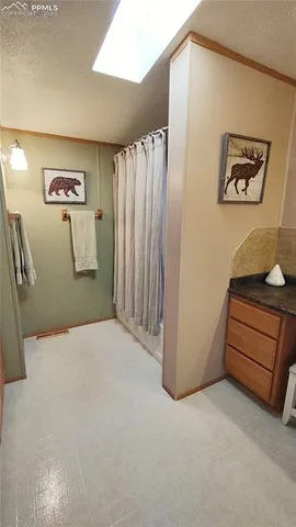 a view of a room with wooden walls