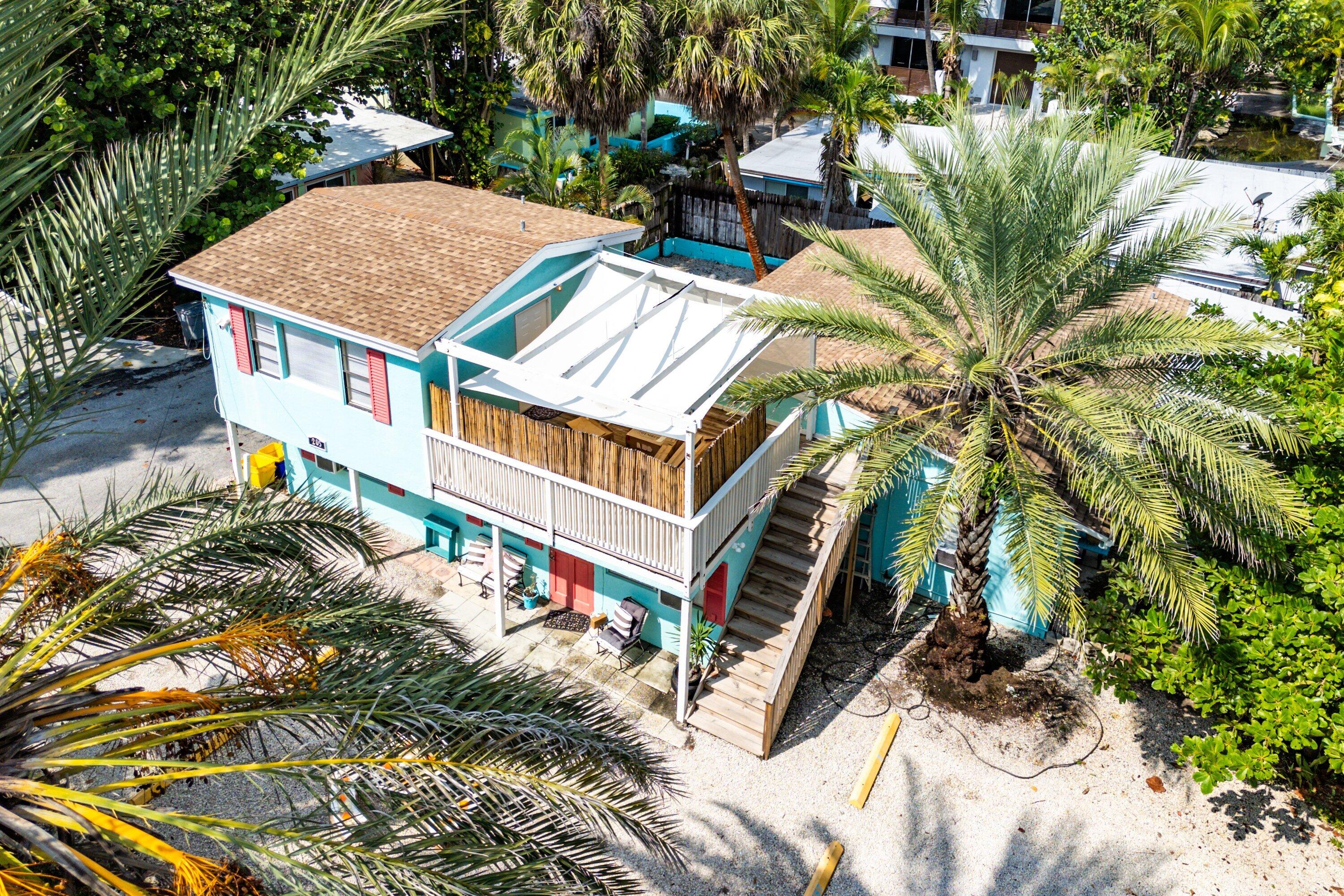 205 Coral Road, Unit 2 Boynton Beach, FL 33435 - Photo 2 of 9 a view of a house with roof deck and sitting area