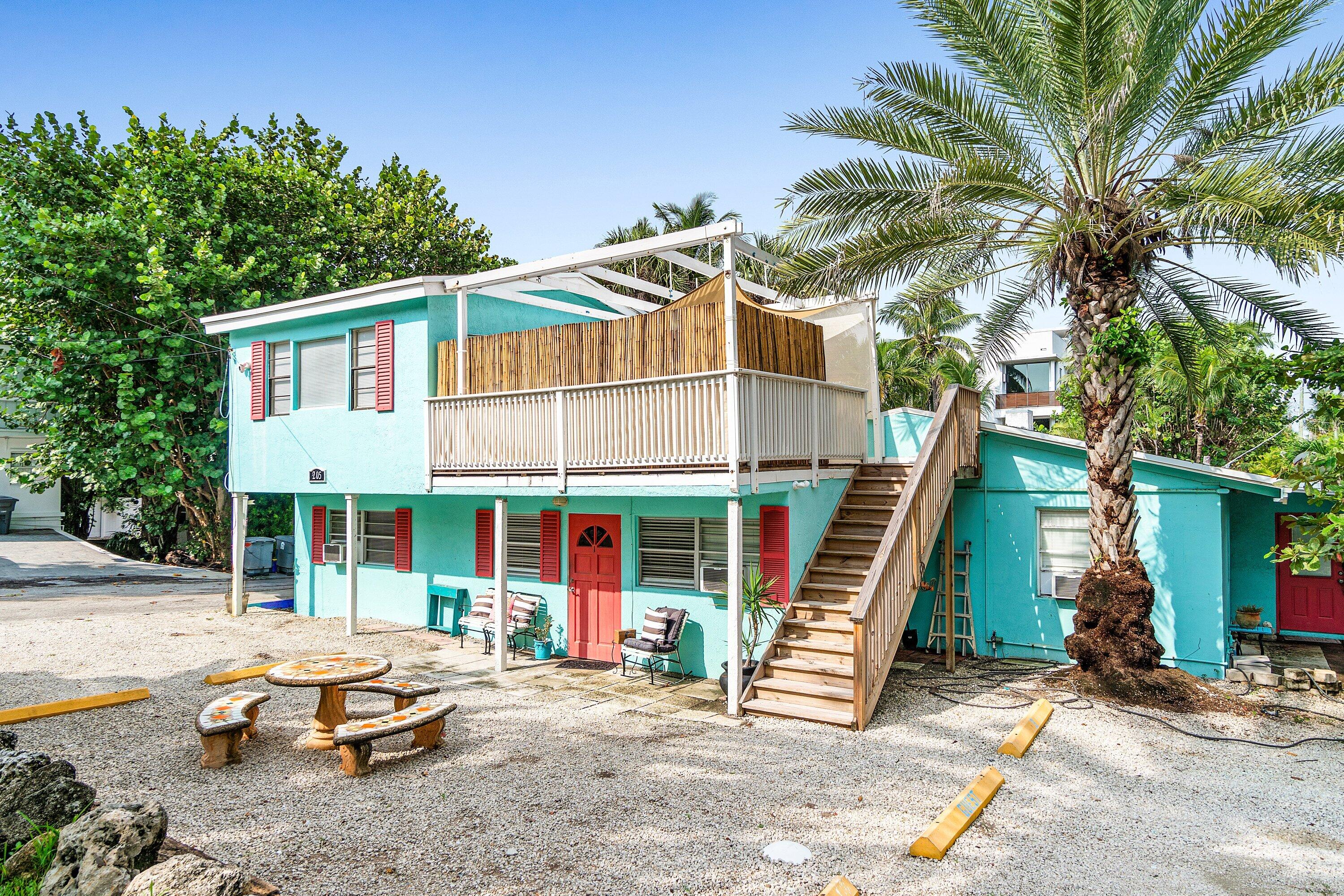 205 Coral Road, Unit 2 Boynton Beach, FL 33435 - Photo 3 of 9 a front view of a house with a garden